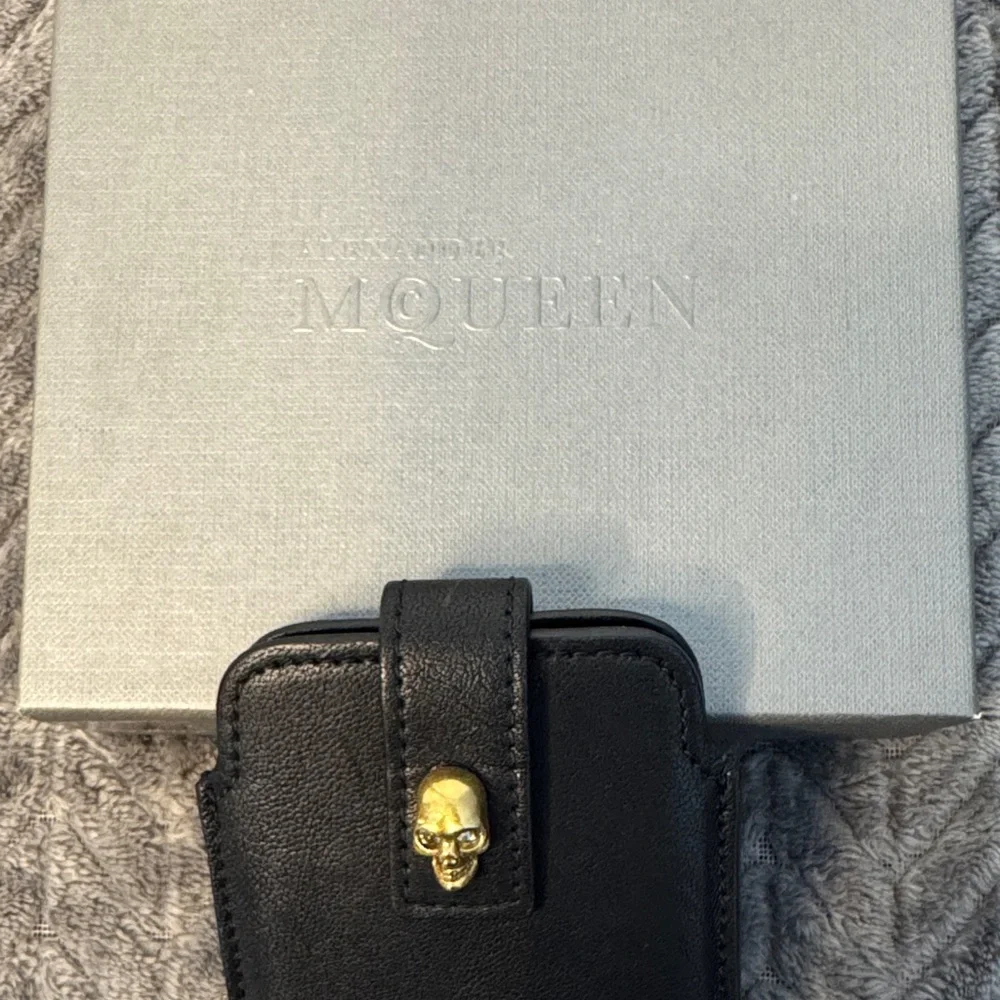 Alexander McQueen Black Phone Holder with Gold Skull Detail